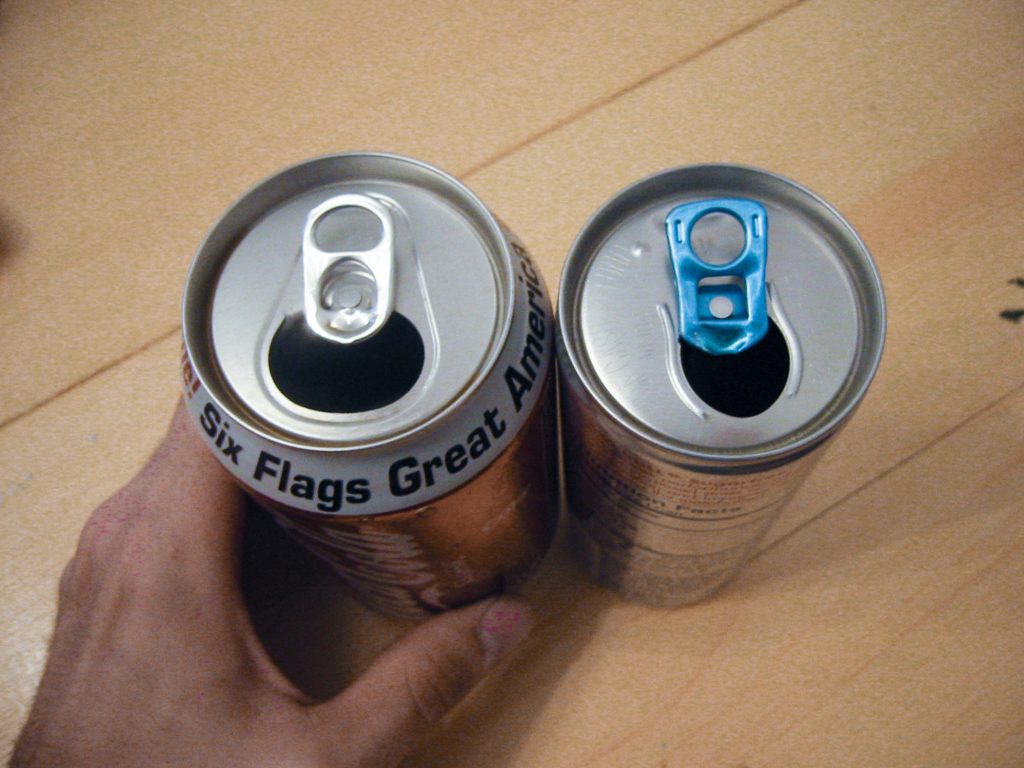 Comparison of a Coca-cola can by a Red Bull can side by side