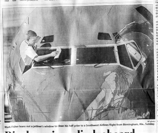 AP photo of pilot cleaning glass