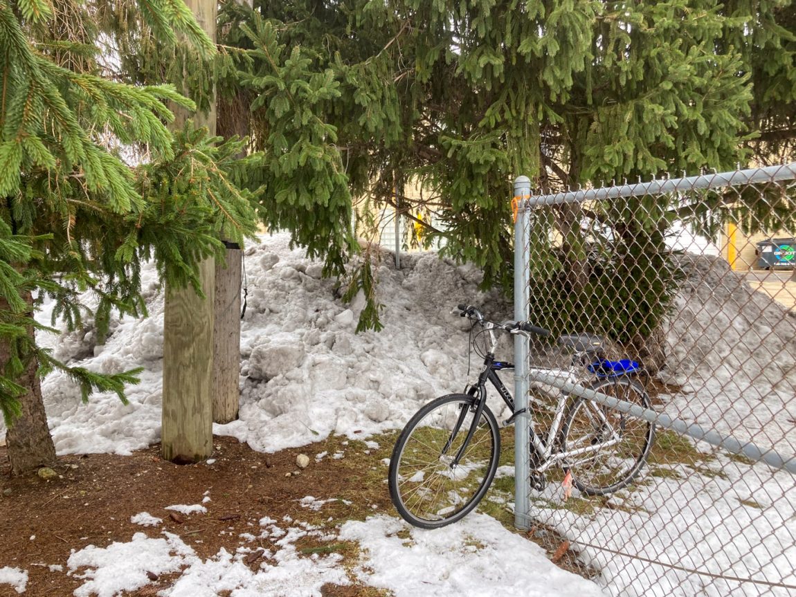 Bicycle locked to fence by Dreisilker Electric Motors in Glen Ellyn, IL USA