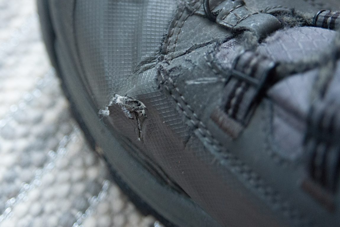 closeup photo of left boot with minor cracking by where the toes bend