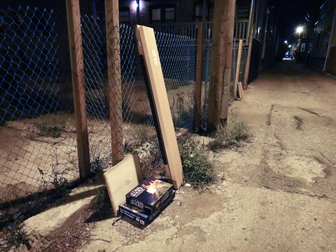 Chicago alley with Free IKEA shelf, with a handwritten note.