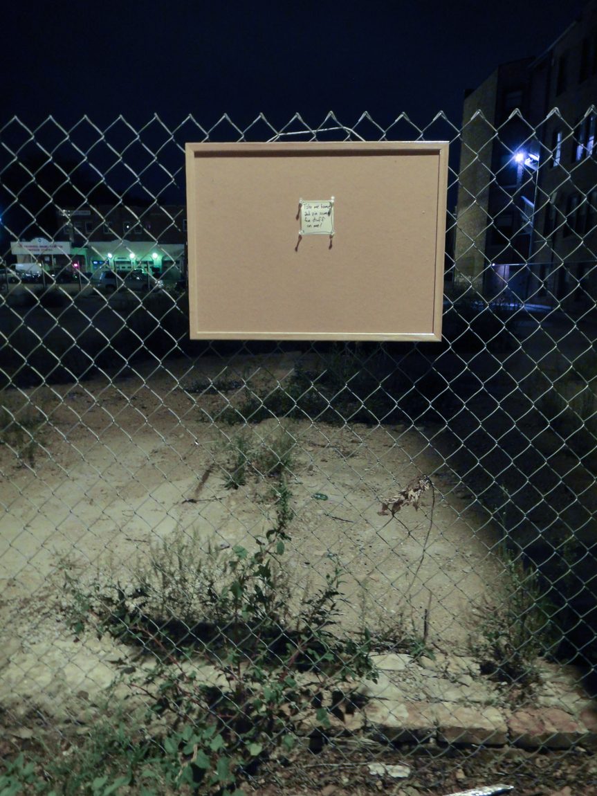 Bulletin board left in alley. The note says, "Take me home and pin some fun stuff on me!"