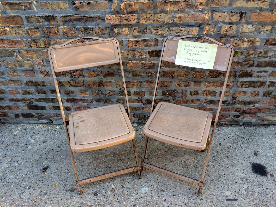 Two metal chairs in a Chicago alley