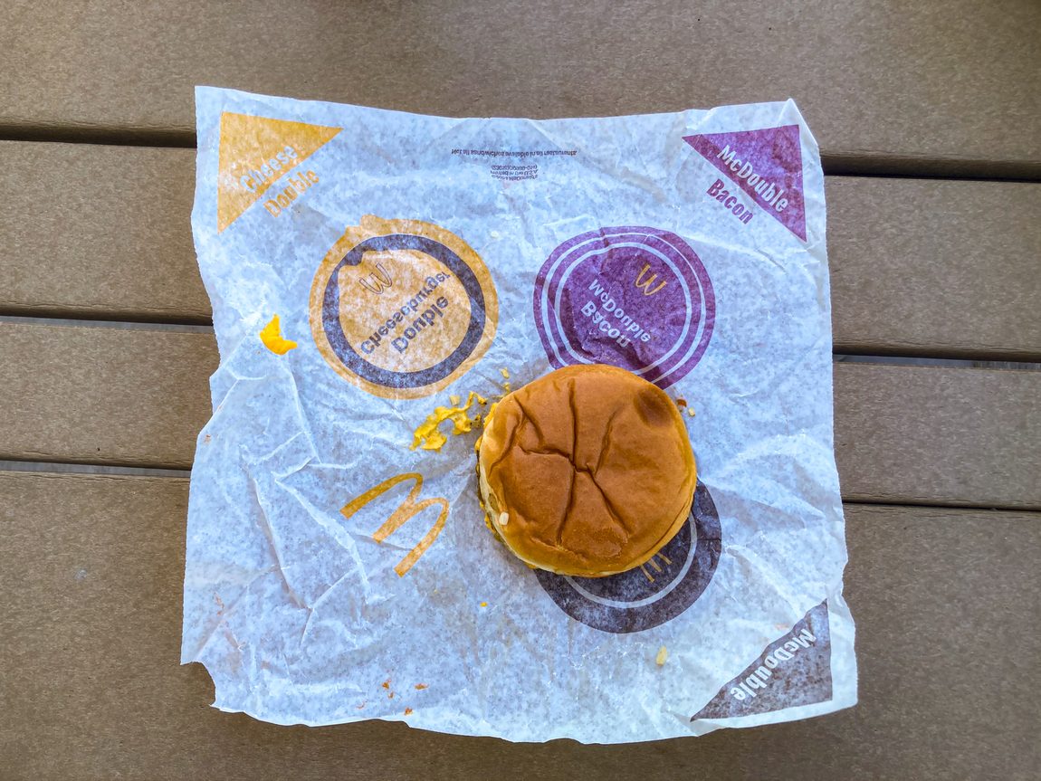 McDouble sitting on open wrapper on table on outdoor patio table.